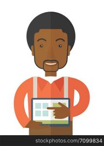 A black man standing while his hand pointing to the tablet. Business concept. A contemporary style. Vector flat design illustration with isoloated white background. Vertical layout.. Man holding a screen tablet