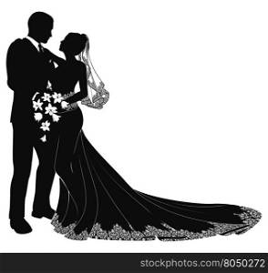 A bride and groom on their wedding day about to kiss in silhouette