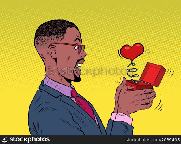 A businessman man looks at a red heart box valentine surprise greeting, love romance. Pop Art Retro Vector Illustration 50s 60s Vintage kitsch Style. A businessman man looks at a red heart box valentine surprise greeting, love romance