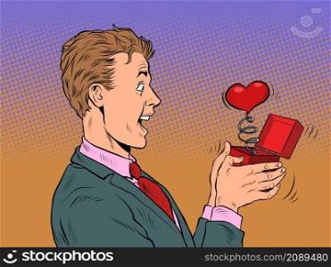 A businessman man looks at a red heart box valentine surprise greeting, love romance. Pop Art Retro Vector Illustration 50s 60s Vintage kitsch Style. A businessman man looks at a red heart box valentine surprise greeting, love romance