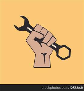 A clenched fist holding a repair tool. Vector illustration. Concept of strike or protest of workers.