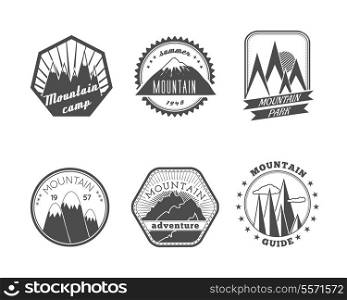 A collection of decorative round and polyangular snowy mountains summer camp labels isolated vector illustration