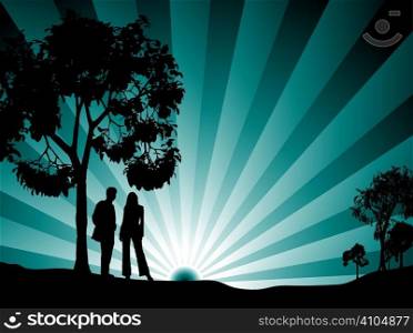 A couple watching the sun rise surrounded by tree