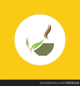 a cup of green tea leaves on a yellow background