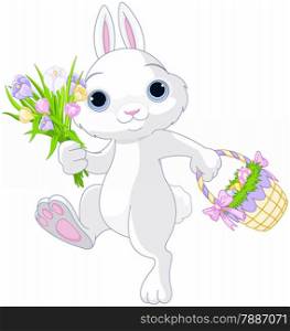 A cute Easter bunny holds full basket of colored eggs and bouquet of flowers
