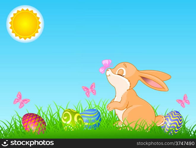 A cute Easter bunny standing near brightly colored eggs. All objects are separate