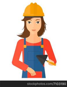 A female bricklayer with a spatula and a brick in hands vector flat design illustration isolated on white background. Vertical layout.. Bricklayer with spatula and brick.