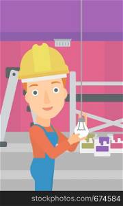 A female worker twisting a light bulb on a background of room with paint cans and ladder vector flat design illustration isolated on white background. Vertical layout.. Electrician twisting light bulb.