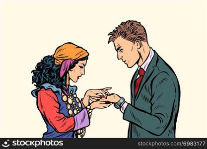 a Gypsy telling fortunes by the hand to the businessman. A fortune-teller palmist. Pop art retro vector illustration kitsch vintage. a Gypsy telling fortunes by hand to businessman