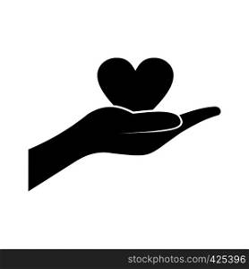 A hand giving a heart black simple icon. A hand giving a heart icon