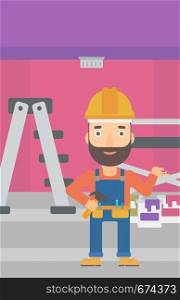 A hipster man in helmet with a hummer and a nail in hands standing on the background of purple walls, paint cans and ladder vector flat design illustration. Vertical layout.. Cheerful repairer engineer.