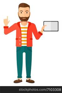 A hipster man standing with a tablet computer and pointing his forefinger up vector flat design illustration isolated on white background. Vertical layout.. Man holding tablet computer.