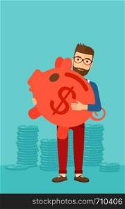 A hipster man with the beard holding a big piggy bank in hands on a blue background vector flat design illustration. Vertical layout.. Man carrying piggy bank.