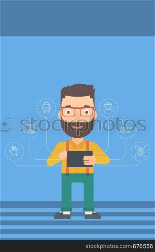 A hipster man with the beard holding a tablet computer and some icons connected to the device on a light blue background vector flat design illustration. Vertical layout.. Man holding tablet computer.
