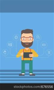 A hipster man with the beard holding a tablet computer and some icons connected to the device on a light blue background vector flat design illustration. Vertical layout.. Man holding tablet computer.