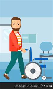 A hipster man with the beard pushing empty wheelchair on the background of hospital corridor vector flat design illustration. Vertical layout.. Man pushing wheelchair.