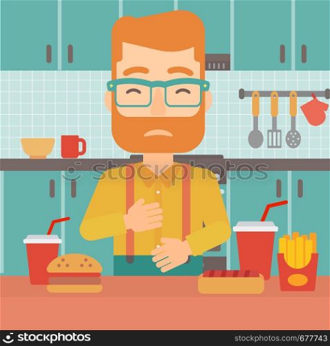 A hipster man with the beard standing in the kitchen in front of table full of junk food and suffering from heartburn vector flat design illustration. Square layout.. Man suffering from heartburn.