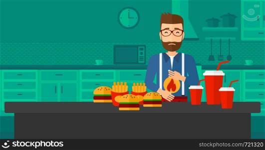 A hipster man with the beard standing in the kitchen in front of table full of junk food and suffering from heartburn vector flat design illustration. Horizontal layout.. Man suffering from heartburn.