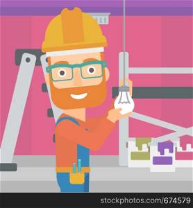 A hipster man with the beard twisting a light bulb on a background of room with paint cans and ladder vector flat design illustration isolated on white background. Square layout.. Electrician twisting light bulb.