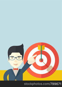 A japanese salesman happy standing while his hand pointing to the arrow from target pad shows that he hit his target sales. Business concept. A Contemporary style with pastel palette, soft blue tinted background. Vector flat design illustration. Vertical layout with text space on top part.. Japanese salesman hit the sales target.