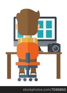 A man facing backward with laptop and camera looking the soft copy of the pictures taken. A Contemporary style. Vector flat design illustration isolated white background. Vertical layout. Man with laptop and camera on a table.