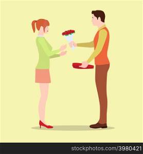 A man gives his girlfriend flowers and a box of chocolates. A loving couple on Valentine's Day exchange gifts.