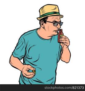 a man sniffs a bottle. perfume or medicine. Pop art retro vector illustration drawing. a man sniffs a bottle. perfume or medicine