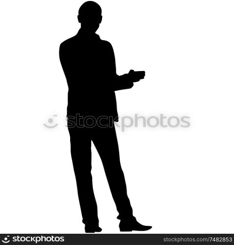 A man stands with his hands in front, silhouette on a white background.. A man stands with his hands in front, silhouette on a white background