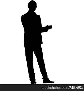A man stands with his hands in front, silhouette on a white background.. A man stands with his hands in front, silhouette on a white background