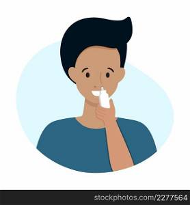 A man treats a runny nose with a spray for a runny nose.