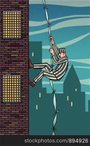 A prisoner escapes from prison. The descent from the heights of related sheets. Jailbreak. Comic cartoon pop art retro illustration hand drawing. A prisoner escapes from prison. Jailbreak. The descent from the heights of related sheets