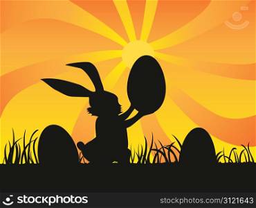 a rabbit holding a egg at sunset for easter day