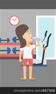 A sportive woman drinking water in the gym vector flat design illustration. Vertical layout.. Woman drinking water.