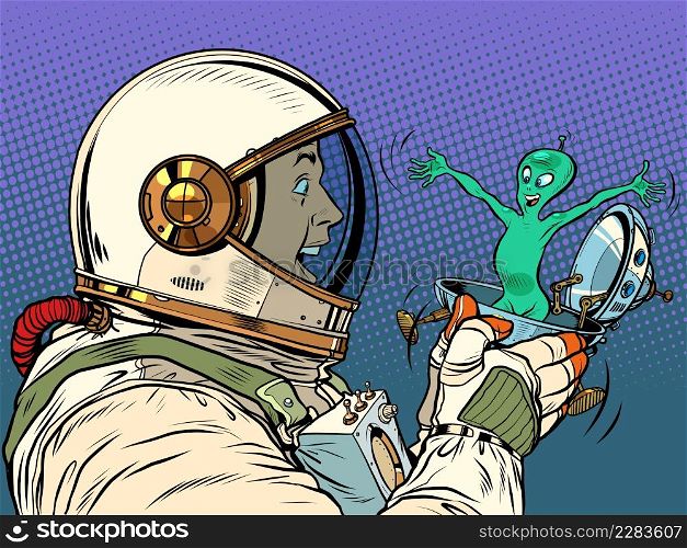 A surprised male astronaut looks at an alien in a festive UFO flying saucer box. Pop Art Retro Vector Illustration 50s 60s Vintage kitsch Style. A surprised male astronaut looks at an alien in a festive UFO flying saucer box