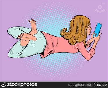 a teenage woman lies and watches a smartphone, lifestyle new technologies, chat on social networks. Pop Art Retro Vector Illustration Vintage Kitsch 50s 60s Style. a teenage woman lies and watches a smartphone, lifestyle new technologies, chat on social networks