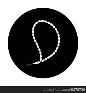 A white and black round pendant with a white bead on a black background