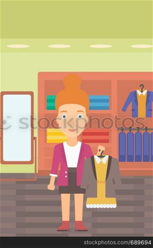 A woman holding a hanger with dress and jacket on the background of clothes store vector flat design illustration. Vertical layout.. Woman holding dress with jacket.