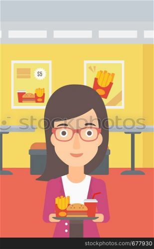A woman holding a tray full of junk food on a cafe background vector flat design illustration. Vertical layout.. Woman with fast food.