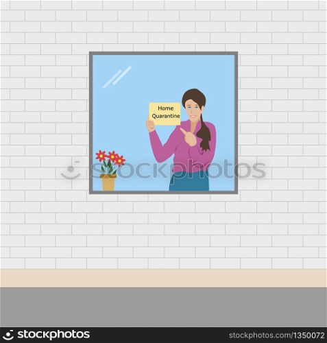 A woman standing at the window holding a sign Home Quarantine with a white brick wall in the background