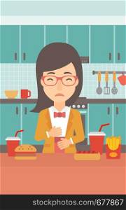 A woman standing in the kitchen in front of table full of junk food and suffering from heartburn vector flat design illustration. Vertical layout.. Woman suffering from heartburn.