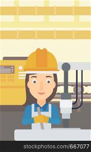 A woman working with an industrial equipment on the background of factory workshop with conveyor belt vector flat design illustration. Vertical layout. . Woman working with industrial equipment.