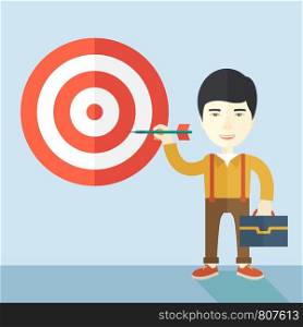A working chinese man with strategy on how to get his target market sales higher. Market strategy concept. A Contemporary style with pastel palette, soft blue tinted background. Vector flat design illustration. Square layout.. Working chinese man holding a target arrow