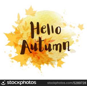 "Abstract autumn background with orange falling maple leaves. "Hello autumn" lettering and yellow watercolor blots."