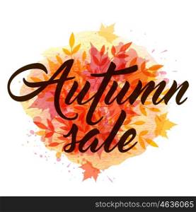 "Abstract autumn background with yellow and red falling leaves. "Autumn sale" lettering and orange watercolor blots."