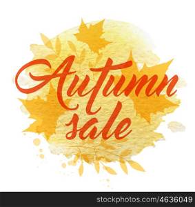 "Abstract autumn background with yellow falling maple leaves. "Autumn sale" lettering and watercolor texture."