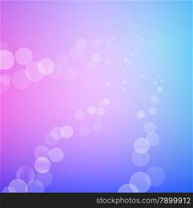 Abstract bokeh sparkle rays on blue blurred background