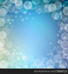 Abstract bokeh sparkles frame with blue blurred background