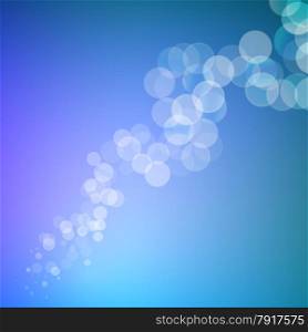 Abstract bokeh sparkles line on blue blurred background