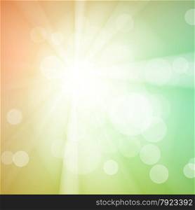 Abstract bokeh sparkles on green blurred background