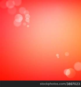 Abstract bokeh sparkles on red blurred background